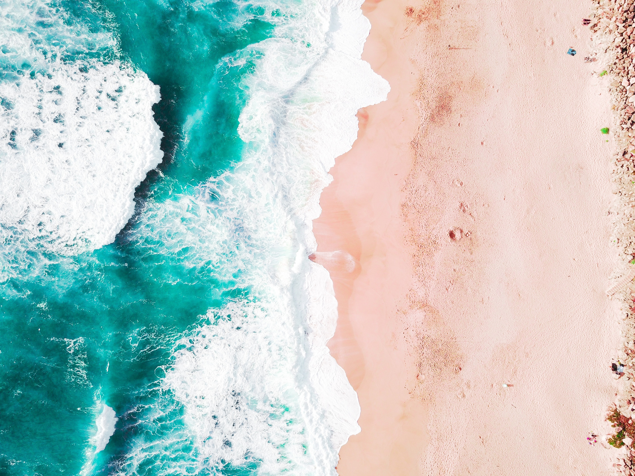 Aerial View of Ocean Waves by the Seashore